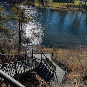 Aluminum stairs and landing over a wooded riverbank, West Michigan aluminum stair builders