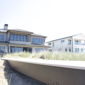 Beachfront seawall installed below a lakefront home on Lake Michigan, seawall construction by Waterfront Solutions
