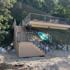 Composite beach deck with aluminum railings and stairs down to the sand, Lake Michigan deck builders