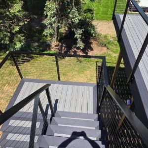 Composite deck with black aluminum railing seen from above, West Michigan composite deck builders