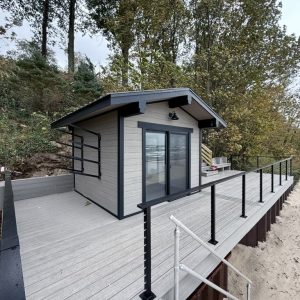 Composite deck and cabana with cable railing above Lake Michigan, composite deck builders