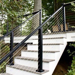 Composite stairs with black posts and cable railing, West Michigan composite stair builders