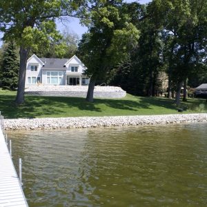 Riprap stone shoreline protection and dock at a lakefront home, West Michigan seawall and dock builders