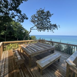 Wood deck with picnic table on a bluff above Lake Michigan, wood deck builders West Michigan