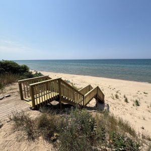 Wooden beach stairs and deck on the sand at Lake Michigan, wooden stair builders West Michigan